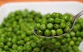 Spoon of sweet peas Royalty Free Stock Photo