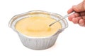 Spoon taking out fresh pudding