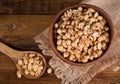 Spoonful and Bowl of Dry Roasted Peanuts Royalty Free Stock Photo