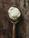 A spoonful of cream cheese on wooden table Royalty Free Stock Photo