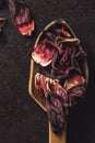 Spoonful dried hibiscus leaves, closeup