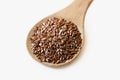 Spoonful of flax seeds isolated on white Royalty Free Stock Photo