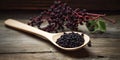 Spoonful of homemade elderberry syrup, set against a wooden backdrop, emphasizing the use of natures ingredients for