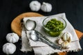 Spoonfuls and garlic. Spices on table