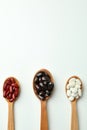 Spoons with different types of beans on white background Royalty Free Stock Photo