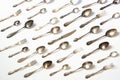 Spoons, forks, knives, silverware pattern on white background. Kitchen texture. Royalty Free Stock Photo