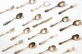 Spoons, forks, knives, silverware pattern on white background. Kitchen texture. Top view Royalty Free Stock Photo