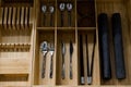 Spoons and other cutlery in a wooden box Royalty Free Stock Photo