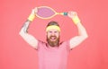 Sport achievement. Athlete hipster hold tennis racket in hand red background. Tennis player vintage fashion. Tennis