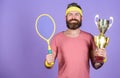 Sport achievement. Celebrate victory. Tennis champion. Athletic man hold tennis racket and golden goblet. Win tennis Royalty Free Stock Photo