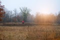 Sport and active healthy life concept. Cyclist in protective in late fall park. Riding on bike on sunny day among trees. Healthy