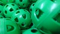 A Pile of Green Perforated Plastic Practice Balls