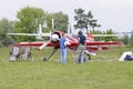 Sport airplanes standing on the landing field, people standing near