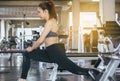 Sport asian woman stretching for warming up befor doing exercises cross fit body muscular training workout in gym Royalty Free Stock Photo