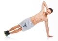 Sport attractive man doing fitness exercises on the white