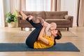 Yoga mom practicing with her toddler baby Royalty Free Stock Photo