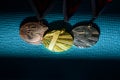 Sport background, gold silver and bronze medal in dark shadow. Original wallpaper for summer olympic game in Tokyo 2020 Royalty Free Stock Photo