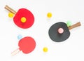 Sport background. Red and black ping-pong rackets and balls. Flat lay, top view. Royalty Free Stock Photo