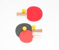 Sport background. Red and black ping-pong rackets and orange balls. Flat lay, top view. Royalty Free Stock Photo