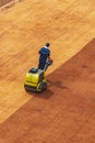 Sport base staff preparing the outdoor tennis fields