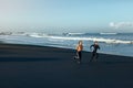 Sport On Beach. Running Couple In Fashion Sportswear On Morning Workout. Sexy Man And Beautiful Woman Jogging. Royalty Free Stock Photo