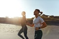 Sport On Beach. Running Couple In Fashion Sportswear On Morning Workout. Sexy Man And Beautiful Woman Jogging. Royalty Free Stock Photo