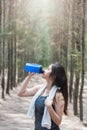 Sport beautiful young woman girl lifestyle exercise healthy drinking protein water after running workout Royalty Free Stock Photo