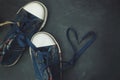 Sport blue Jeans Boots Children Heart Shape Laces over Textured Grounge Chalckboard. Toned. Education and Parenting