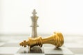 Sport board game, Business and planning concept. Closeup of falling gold and silver King chess piece on chessboard with copy space