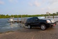 Truck launching fishing boat at ramp