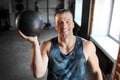 happy smiling young man with medicine ball in gym Royalty Free Stock Photo