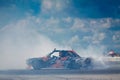BMW M3 turns with oversteering and heavy smoke coming from rear tires, Vinnytsia Drift Competition 09.07.2017, editorial photo
