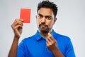 Indian referee with whistle showing red card Royalty Free Stock Photo