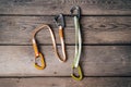 Sport climbing equipment like carabiners and slings on wooden background Royalty Free Stock Photo
