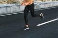 Sport. Close Up Of Male Legs Running On Road Outdoors.