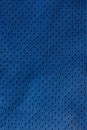 Sport Clothing Fabric Texture Background. Top View of Cloth Textile Surface. Blue football shorts. Copy Space. Seamless perforated Royalty Free Stock Photo