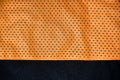 Sport clothing fabric texture background, top view of orange cloth textile surfac Royalty Free Stock Photo