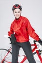 Sport Concepts. Portrait of Positive Female Road Cyclist Posing With Modern Race Bike Against White Background