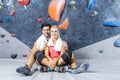 Sport Concepts. Young Joyful couple Preparing To Bouldering climbing up the wall together While Resting Together Royalty Free Stock Photo