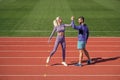 sport couple celebrate team win. fitness partners. athletic man and sexy woman compete in armwrestling. male and female Royalty Free Stock Photo