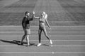 sport couple celebrate team win. fitness partners. athletic man and sexy woman compete in armwrestling. male and female Royalty Free Stock Photo