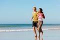 Sport couple jogging on the beach Royalty Free Stock Photo