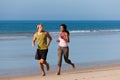 Sport couple jogging on the beach Royalty Free Stock Photo