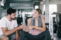 Sport Couple Love Sharing a Bottle of Water Together After Exercised in Fitness Club, Attractive Sporty Young Couple Enjoy Royalty Free Stock Photo