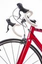 Sport Cycling Concepts. Road Bike Handlebars with White Tape Placed With Wheel Against White