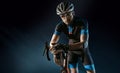 Sport. Cyclist carry a bike on black background. Royalty Free Stock Photo