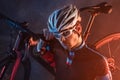 Sport. Cyclist carry a bike on dramatic background. Royalty Free Stock Photo