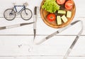 Sport and diet concept - bicycle model, fresh vegetables and ce Royalty Free Stock Photo