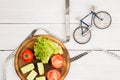 Sport and diet concept - bicycle model, fresh vegetables and ce Royalty Free Stock Photo