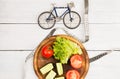 Sport and diet concept - bicycle model, fresh vegetables and ce Royalty Free Stock Photo